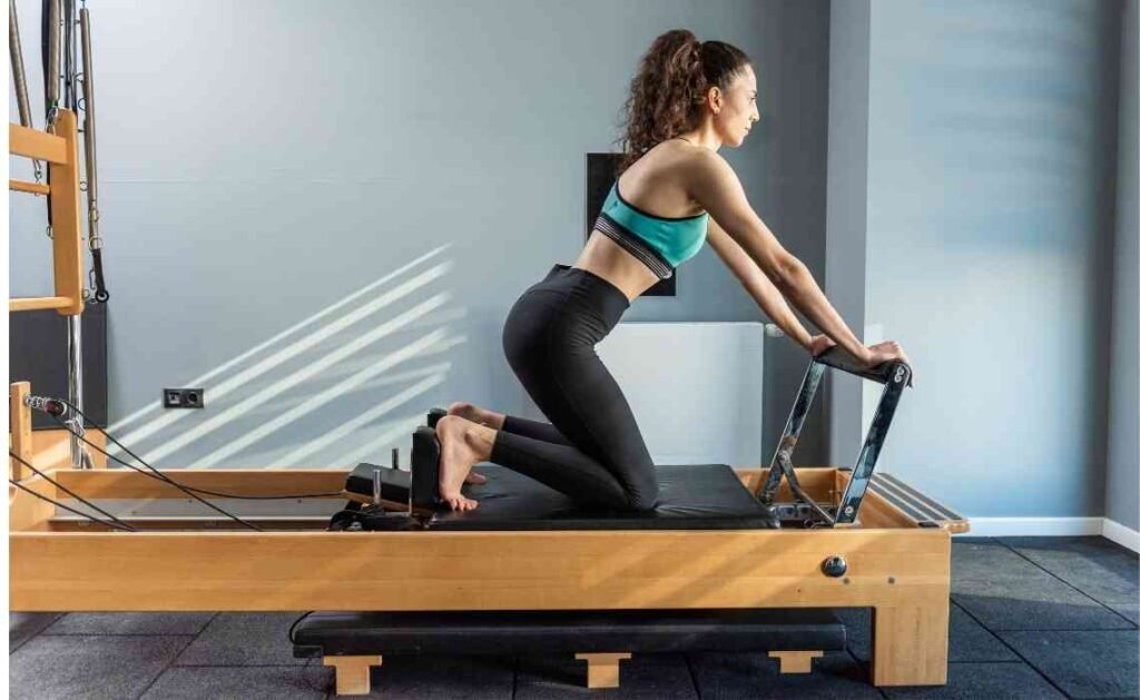 pilates on reformer exercise machine