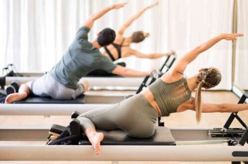pilates reformer exercise using the reformer machine