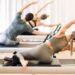 pilates reformer exercise using the reformer machine
