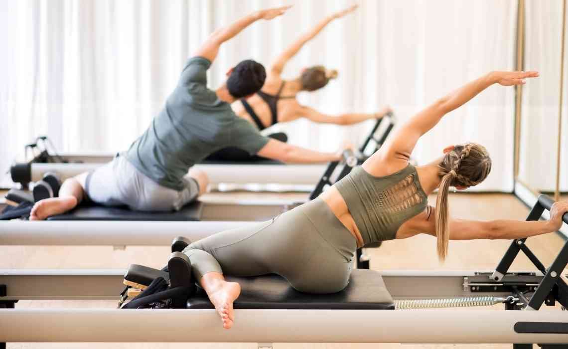 pilates reformer exercise using the reformer machine