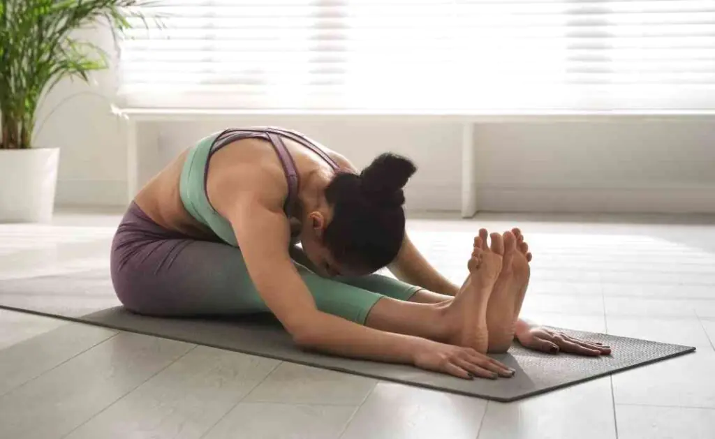 paschimottanasana or seated forward bend pose in yoga